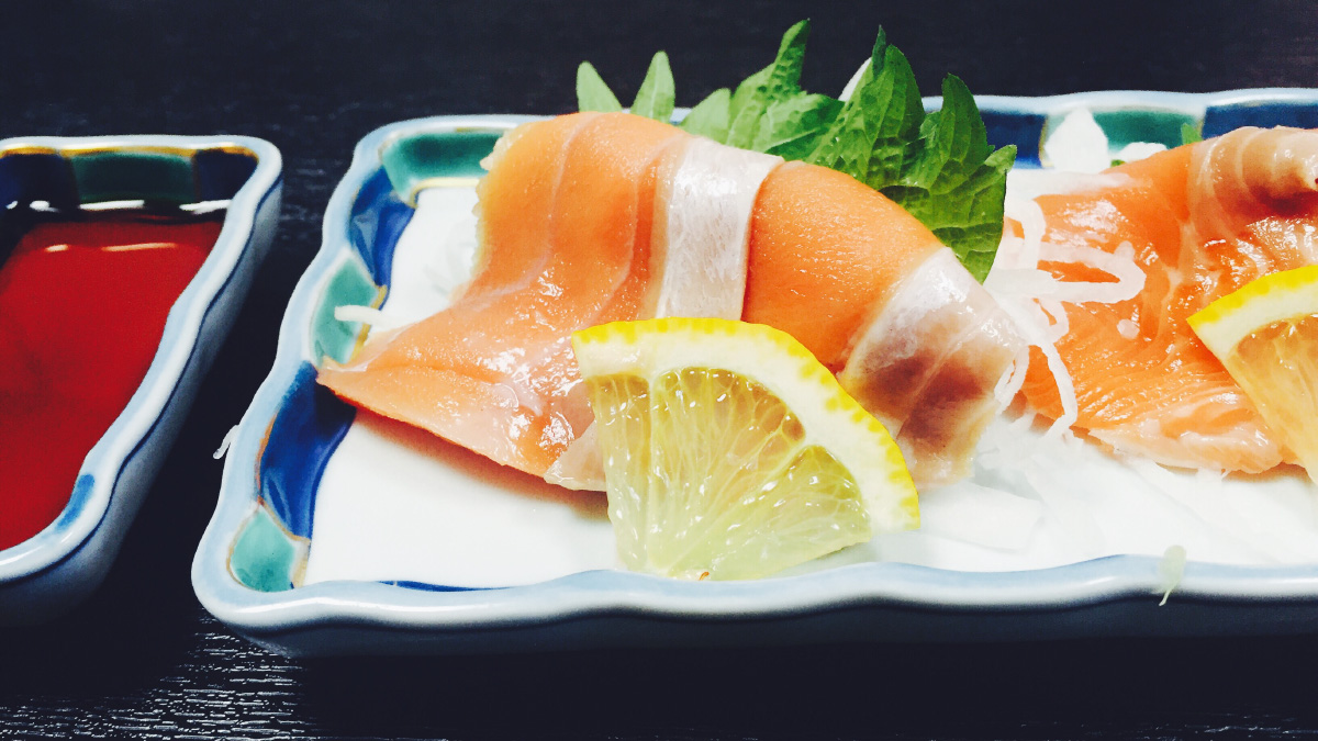 Shibetsu Shiro salmon on the plate with shoyu at Takeda Restaurant